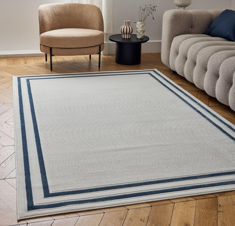 Featured image for “Cream Rug With Blue Boarder”